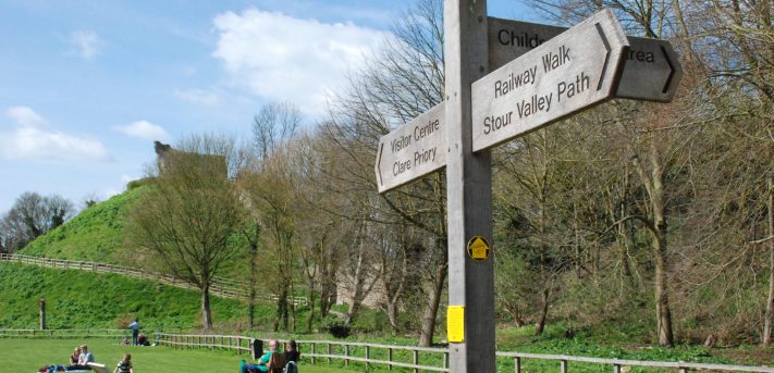 Claire CP sign Stour Valley Path wooden finger post sign at Clare Castle Country Park on a sunny day