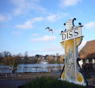 Large Diss sign at Diss Mere on a sunny day