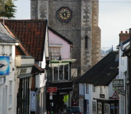 an old street in Diss, with the Church clock tower in the background