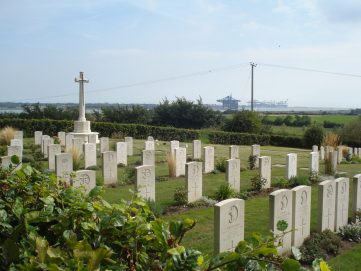 The Naval Cemetery at Shotley, with Felixstowe Port in the background